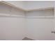 This walk-in closet has shelving on all sides to provide ample storage space for clothing at 6288 Dolosonte St, Las Vegas, NV 89113