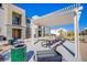 Outdoor common area features picnic tables, BBQ grills, and a pergola, offering residents a comfortable gathering space at 6288 Dolosonte St, Las Vegas, NV 89113