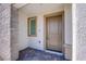 Inviting front entrance with a stylish stone accent wall and a neutral-toned door, offering a welcoming first impression at 6288 Dolosonte St, Las Vegas, NV 89113