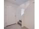 The entryway is bright, with light tile flooring, and has a stairwell leading to the upper level at 6288 Dolosonte St, Las Vegas, NV 89113