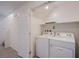 Laundry room with white washer and dryer at 6288 Dolosonte St, Las Vegas, NV 89113