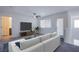 Bright, modern living room with neutral tones and comfortable seating at 6288 Dolosonte St, Las Vegas, NV 89113