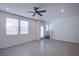 Tiled living room showcases a staircase to the second floor, recessed lighting and multiple windows at 6288 Dolosonte St, Las Vegas, NV 89113