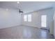 Bright and airy living room is accentuated by tiled floors, recessed lights and a modern ceiling fan at 6288 Dolosonte St, Las Vegas, NV 89113