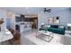 Well-decorated living space with an open layout, featuring a modern kitchen, dining area, and comfortable living room setup at 6288 Dolosonte St, Las Vegas, NV 89113