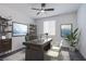 Home office features a sleek desk and plenty of natural light at 6288 Dolosonte St, Las Vegas, NV 89113