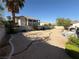 Large backyard featuring a newly landscaped space with gravel and minimal greenery at 6351 Davidson Ct, Las Vegas, NV 89110