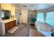 Large bathroom with double sinks, jetted tub, and walk-in shower at 6351 Davidson Ct, Las Vegas, NV 89110