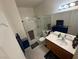 Bright bathroom with shower and vanity, adorned with blue decor at 6351 Davidson Ct, Las Vegas, NV 89110