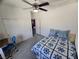Bedroom featuring carpeted flooring, a ceiling fan, and a window for natural light at 6351 Davidson Ct, Las Vegas, NV 89110