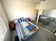 Bright bedroom features a mirrored closet, neutral carpet, and a large window at 6351 Davidson Ct, Las Vegas, NV 89110
