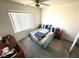 Bright bedroom with a comfortable bed and neutral colors at 6351 Davidson Ct, Las Vegas, NV 89110