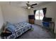 Bedroom featuring carpeted flooring, a ceiling fan, and a window for natural light at 6351 Davidson Ct, Las Vegas, NV 89110