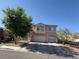 Charming two-story home with a spacious three car garage and well-maintained front yard at 6351 Davidson Ct, Las Vegas, NV 89110