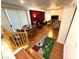 Spacious open-concept living area with hardwood floors, ample natural light, and a view of the stairs at 6351 Davidson Ct, Las Vegas, NV 89110