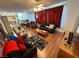 Open concept living space with hardwood floors, recessed lighting, and comfortable seating arrangements at 6351 Davidson Ct, Las Vegas, NV 89110
