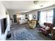 Large main bedroom featuring a sitting area, carpeted flooring, and natural light from windows at 6351 Davidson Ct, Las Vegas, NV 89110