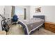 Comfortable bedroom features a gamer setup with a guitar and natural light at 6425 Classic Ridge St, North Las Vegas, NV 89086
