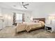Comfortable main bedroom with natural light, ceiling fan, and neutral decor at 6425 Classic Ridge St, North Las Vegas, NV 89086