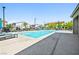 Community pool with clear blue water, lounge chairs, and well-maintained surroundings for residents to relax and enjoy at 6425 Classic Ridge St, North Las Vegas, NV 89086