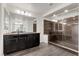 Elegant bathroom featuring granite counters, a large walk-in shower, and modern fixtures at 6540 W Cougar Ave, Las Vegas, NV 89139