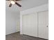 Bedroom featuring plank flooring, and a large sliding door closet for ample storage at 6540 W Cougar Ave, Las Vegas, NV 89139