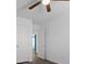 Cozy bedroom with ceiling fan, neutral walls, and access to another room at 6540 W Cougar Ave, Las Vegas, NV 89139