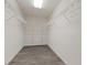 Organized walk-in closet featuring white wire shelving and modern flooring at 6540 W Cougar Ave, Las Vegas, NV 89139