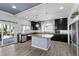 Updated kitchen featuring an island with granite countertops and stainless steel appliances at 6540 W Cougar Ave, Las Vegas, NV 89139