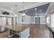 Modern kitchen island with granite countertop and stainless steel appliances create an open-concept design at 6540 W Cougar Ave, Las Vegas, NV 89139