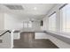 Bright and airy living space with expansive windows, gray accents and modern design at 6540 W Cougar Ave, Las Vegas, NV 89139