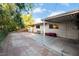Spacious backyard features a covered patio and tiled space, ideal for outdoor living at 6608 Burgundy Way, Las Vegas, NV 89107