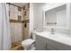 Bathroom with neutral tile in shower and gray vanity at 6608 Burgundy Way, Las Vegas, NV 89107