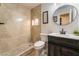 Modern bathroom with a walk-in shower with tile surround, and sleek vanity with dark wood cabinets at 6608 Burgundy Way, Las Vegas, NV 89107