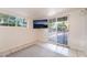 Bright bedroom featuring a sliding glass door with backyard access at 6608 Burgundy Way, Las Vegas, NV 89107