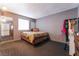 Bedroom with mirrored closet doors and neutral decor showcasing comfortable living at 6608 Burgundy Way, Las Vegas, NV 89107