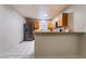 Bright kitchen featuring stainless steel refrigerator and a breakfast bar with seating at 6608 Burgundy Way, Las Vegas, NV 89107