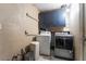Functional laundry room with washer, dryer, and overhead cabinets at 6608 Burgundy Way, Las Vegas, NV 89107