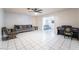 Spacious living room with tile floors, comfortable seating, and a cozy atmosphere at 6608 Burgundy Way, Las Vegas, NV 89107