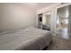 Bedroom featuring carpet, a closet with mirrored doors, and a view to the hallway at 6929 Montcliff Ave, Las Vegas, NV 89147