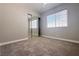Bedroom with carpet, closet with mirrored doors, and window at 6929 Montcliff Ave, Las Vegas, NV 89147