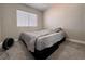Simple bedroom with a neutral color scheme and carpet flooring at 6929 Montcliff Ave, Las Vegas, NV 89147