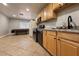 Functional kitchen featuring granite countertops, light wood cabinets, and appliances including an oven at 6929 Montcliff Ave, Las Vegas, NV 89147