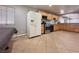 The kitchen features stainless steel appliances, granite countertops and tile flooring at 6929 Montcliff Ave, Las Vegas, NV 89147