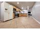 The kitchen features stainless steel appliances, granite countertops and tile flooring at 6929 Montcliff Ave, Las Vegas, NV 89147