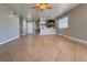 Expansive living room with tile flooring, connecting to the entryway and offering access to other areas at 6929 Montcliff Ave, Las Vegas, NV 89147