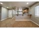 Open-concept space with tile flooring, leading to the kitchen and entry door, creating a welcoming atmosphere at 6929 Montcliff Ave, Las Vegas, NV 89147