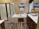 Bathroom featuring double sinks, a stand-alone shower, and a large soaking tub at 7524 Midnight Rambler St, Las Vegas, NV 89149