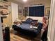 A bedroom with a bed, clothing, and decor at 7524 Midnight Rambler St, Las Vegas, NV 89149