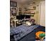 Well-lit bedroom with sports-themed decorations and shelving to display items at 7524 Midnight Rambler St, Las Vegas, NV 89149